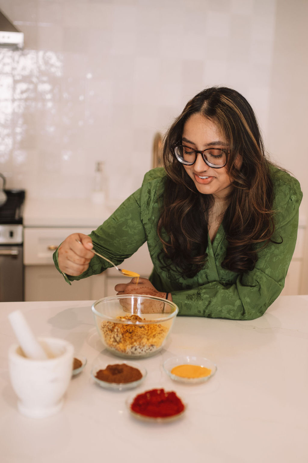Sheyna Patel cooking at a kitchen counter